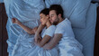 © Prostock-studio - Husband And Wife Hugging Sleeping Together Lying In Bed At Home, Above View Shot. Married Couple Resting In Cozy Bedroom, Embracing And Napping. Happy Marriage Concept