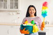 © Prostock-studio - Happy asian lady with cleaning tools posing at kitchen, wearing rubber gloves, young chinese woman raising dust brush up while house-keeping apartment, copy space. House-keeping concept