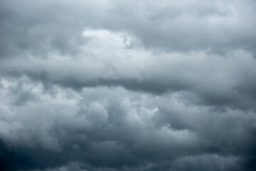 Wall Mural - a sky filled with blueish storm clouds as rain approaches