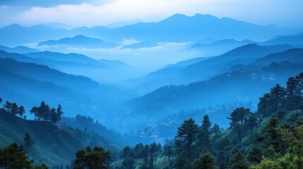 Naklejka na meble Serene mountain landscape shrouded in blue mist, evoking tranquility and natural beauty.