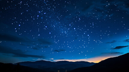Wall Mural - dark blue night sky filled with stars above a tree-filled landscape