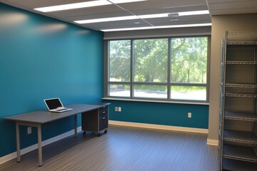 Aufkleber - A modern office space with a desk, laptop, and large window overlooking greenery.