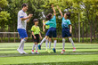 © Blue Jean Images - Chinese Coach and Kids in Football Training Class