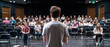 © Mrammon - A high school drama rehearsal with students practicing lines on stage.