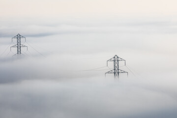 fog-shrouded power lines.