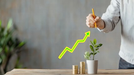 Wall Mural - A hand holding a pencil draws a growth arrow above a plant in a pot, symbolizing financial growth and prosperity with coins in the foreground.