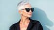 © GoodandEvil - Stylish woman with short white hair and sunglasses