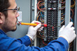 © He - Electrician technician working electrical panel uniform gloves tool wire