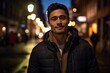 © Inigo - Portrait of a handsome young man on the street at night.