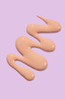 © Westend61 - Liquid foundation texture on a pastel background