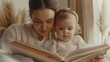 © Z A C - A serene scene unfolds as a woman and a baby sit together engrossed in a book.