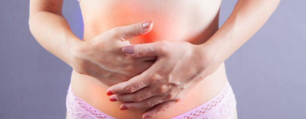 Wall Mural - woman holds life pain in stomach