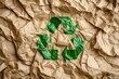 © khalid_spk - Crumpled brown paper green recycling symbol close-up texture environmental awareness waste reduction paper recycling