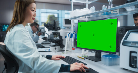 Aufkleber - Medical Research and Development Laboratory: Beautiful Asian Female Scientist Working on a Computer with a Green Screen Chroma Key Template. Modern Genetic Engineering Lab