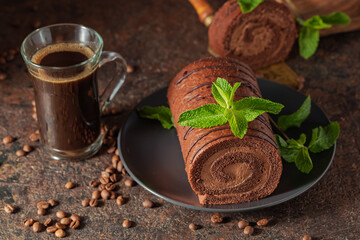 Wall Mural - Homemade chocolate cake and a mug of black coffee.