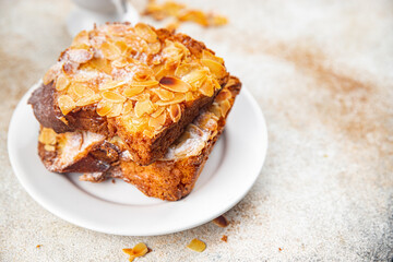 Wall Mural - Brioche sweet almond french toast fresh tasty food dish delicious gourmet food background on the table rustic food top view copy space