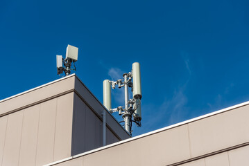 cell site, cellular network 5g antenna on the building roof.