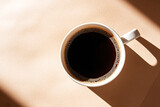 Cup of espresso, americano, black coffee with hard light. Morning coffee.