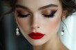 © Michael - Close-up of a beautiful woman with red lipstick and golden eyeshadow, showcasing a professional make-up look