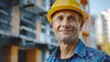© BRH - Smiling engineer wearing hard hat at construction site with Copyspace