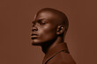 © Cherstva - Closeup of African man with mocha mousse brown jacket in vibrant setting. Modern trendy tone hue shade