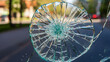 © Inovop - Shattered safety glass with circular pattern showing impact point detail