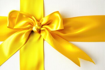 Golden Celebration: Beautiful Yellow Ribbon and Bow Isolated on White Background