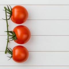 Wall Mural - Three ripe tomatoes on a vine, arranged neatly against a white wooden background, showcasing their vibrant red color and fresh appearance.