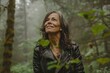 © Markus Schröder - Portrait of a happy woman in her 50s sporting a classic leather jacket over backdrop of a mystical forest