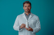 © Olga - a man in a doctor's coat holds a white pill jar in his hands. for advertising. for business. for banners.