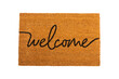 © Avocado_studio - Door mat. Welcome mat isolated on white background. Women's shoes on a doormat on a white background. Interior decor element in the hallway. Close-up.