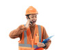 © Fajar - Young Indonesian male construction worker in full safety gear is on a voice call with his co-worker while holding a clipboard, construction and industry concept, isolated on white background.