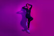 © deagreez - Full body photo of attractive young woman touch hand jumping dressed stylish overall clothes isolated on neon light pink color background