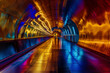 © AI_images - A glowing neon tunnel with radiant hues of gold and deep blue, casting dynamic reflections along its metallic surface.