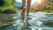 © Oleksiy - Woman dipping feet in mountain river outdoors, closeup. Space for text