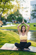 © Strelciuc - A Serene Woman Joyfully Practicing Yoga Outdoors Surrounded by the Beauty of Nature