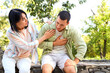 © Pixel-Shot - Young woman with her husband having heart attack in park