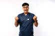 © ArvStd - Excited young Asian male professional nurse working wearing a blue uniform standing confident while saying yes and celebrating victory isolated on white background. Healthcare medicine concept