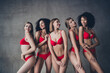 © deagreez - Unretouched photo of five stunning young model girls smile posing red underwear concrete wall studio background