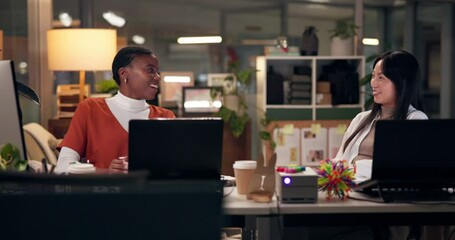 Computer, design and web development with business people in office at night for project management. Collaboration, creative and laughing with website developer women in workplace for programming