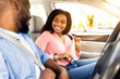 © Prostock-studio - Safety First. Smiling African American Couple Fastening Seatbelts Before Driving In City, Sitting Inside New Luxury Car, Following Safe Ride Rules, Ready For Travel With Auto, Looking At Each Other