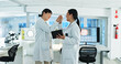 © peopleimages.com - Scientist, women and high five for research, success and experiment results or medical information. Breakthrough, celebration and lab technician with tech for virus development or pathology test