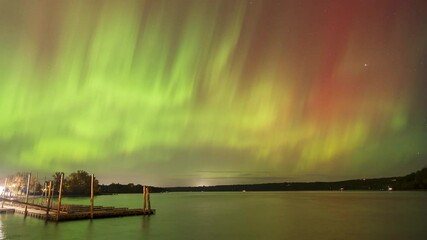 Wall Mural - Northern Lights shimmering over the St. Croix River. in Wisconsin, USA. Natural Phenomenon.