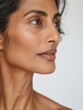 © MakeStories.com - elegant mature older woman beauty closeup studio portrait - skincare beige and white aesthetic, diverse beauty