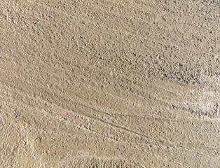 Poster - A sandy surface with a few rocks scattered about