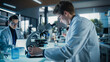 © Gorodenkoff - Portrait of a Handsome Caucasian Student Working on a Research Project in University. Medical Research Scientist Looking at Biological Samples Under a Microscope in an Applied Science Laboratory