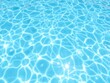© Katherina - Clear blue water in a sparkling swimming pool on a sunny day, relaxation