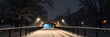 © Moody - A captivating winter scene with a snowy bridge lit by warm street lamps, creating a magical and atmospheric image.
