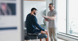 © peopleimages.com - Physiotherapy, tablet and shoulder pain with people in clinic for rehabilitation, healthcare or consulting. Support, medical and chiropractor with man and athlete for healing, advice or report