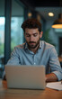 © fotoluigi868 - Businessmen like him work on multiple tasks while using laptops in their modern workplace jobs that require strategy and research._00001_